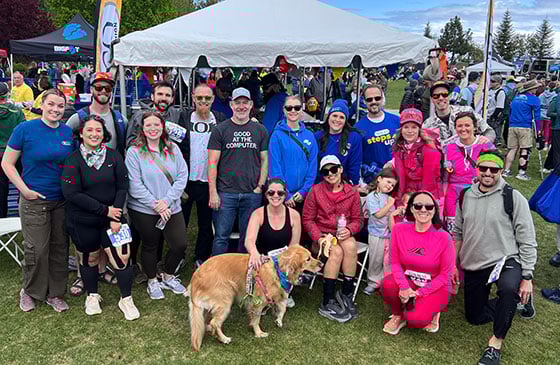 A group of people and dog who participated in SELCO Pole Pedal Paddle.