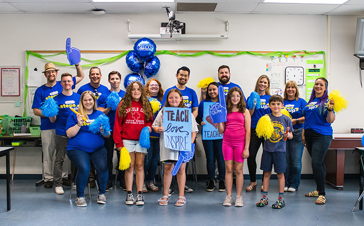 SELCO employees and children celebrating teachers.