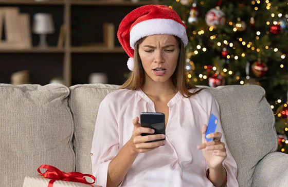 Concerned woman in a Santa hat