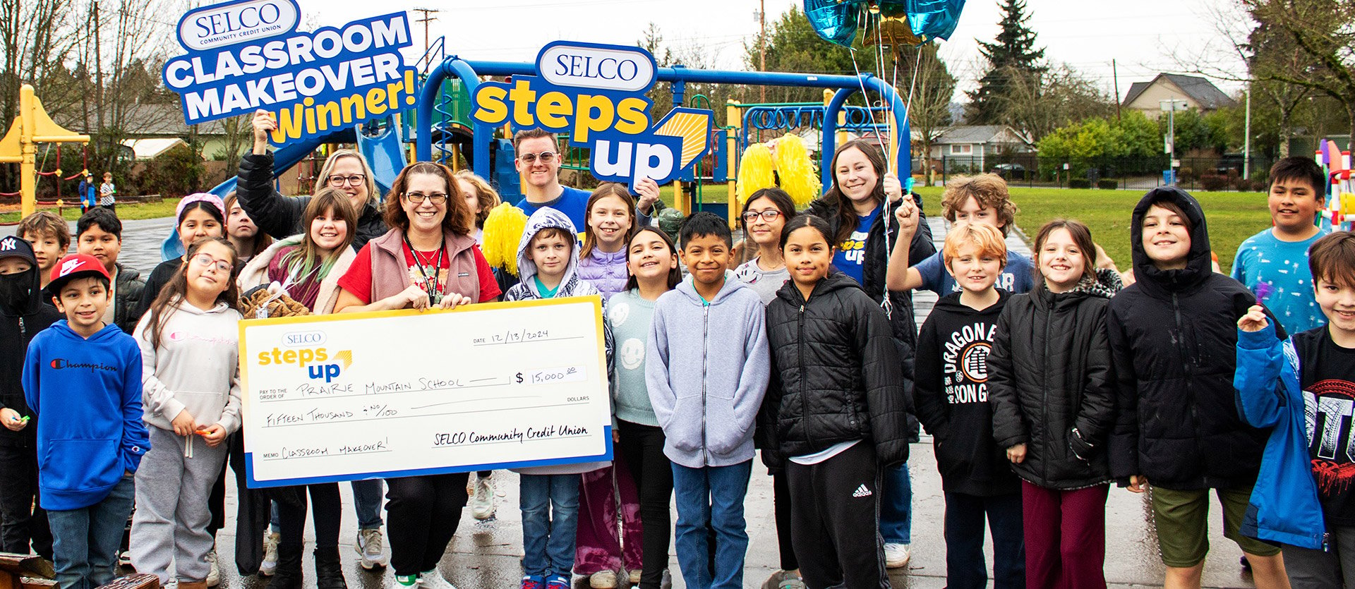 Prairie Mountain School classroom makeover recipient and children. 