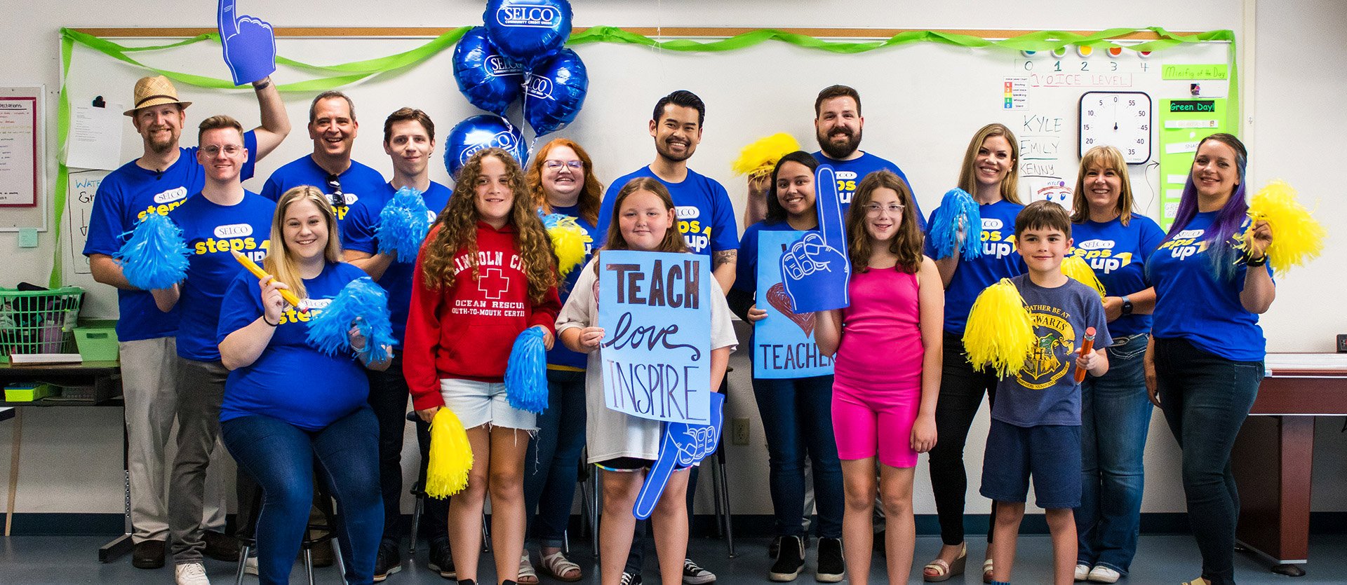 SELCO employees in a classroom celebrating educators. 