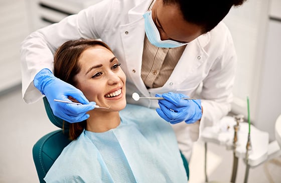 Woman getting dental services done that is being covered under SELCO Dental Insurance