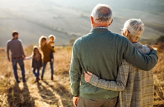 Family members across generations together outdoors, symbolizing wealth transfer planning, estate planning, inheritance strategies, and legacy preservation.