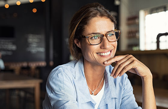 Person with glasses smiling