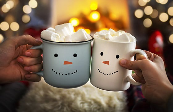 Holiday cheer mugs with smiley faces. 