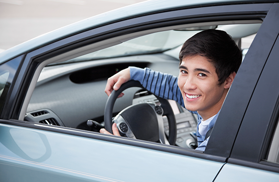 Young man sitting in a car