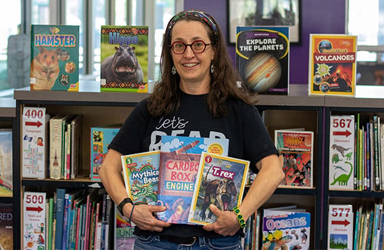 Martha Dyer standing in her classroom. 